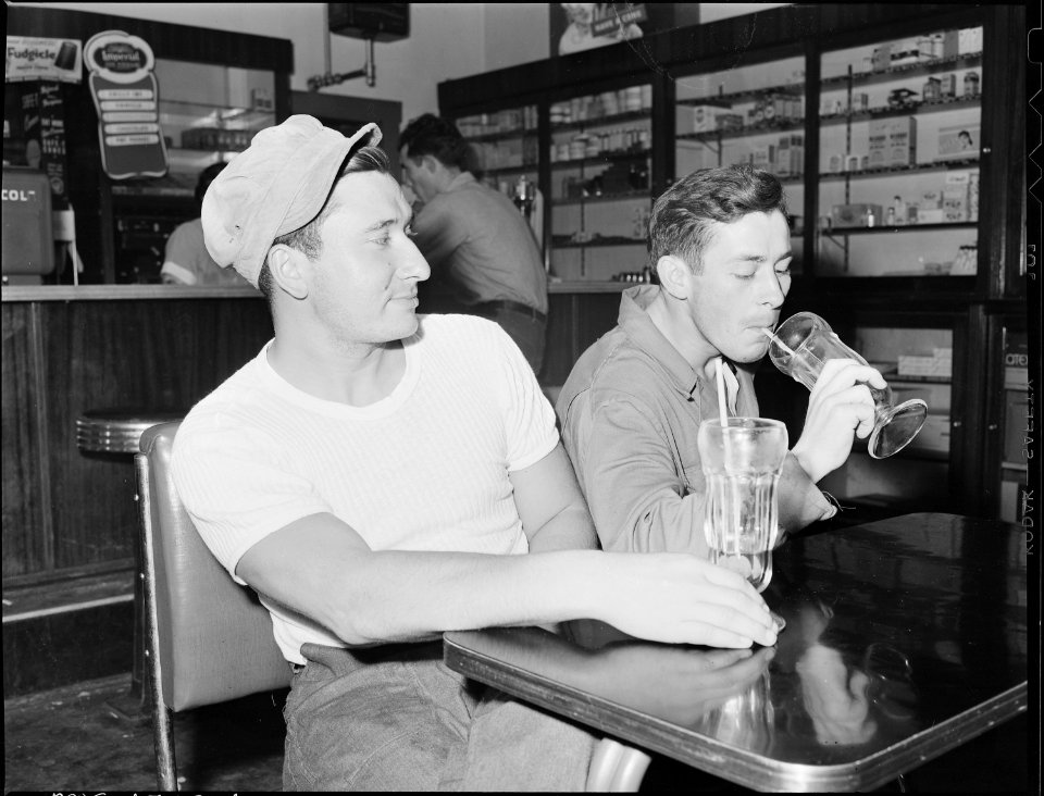 Two miners drink a soda in company owned grill. Koppers Coal Divison, Kopperston Mines, Kopperston, Wyoming County... - NARA - 540927