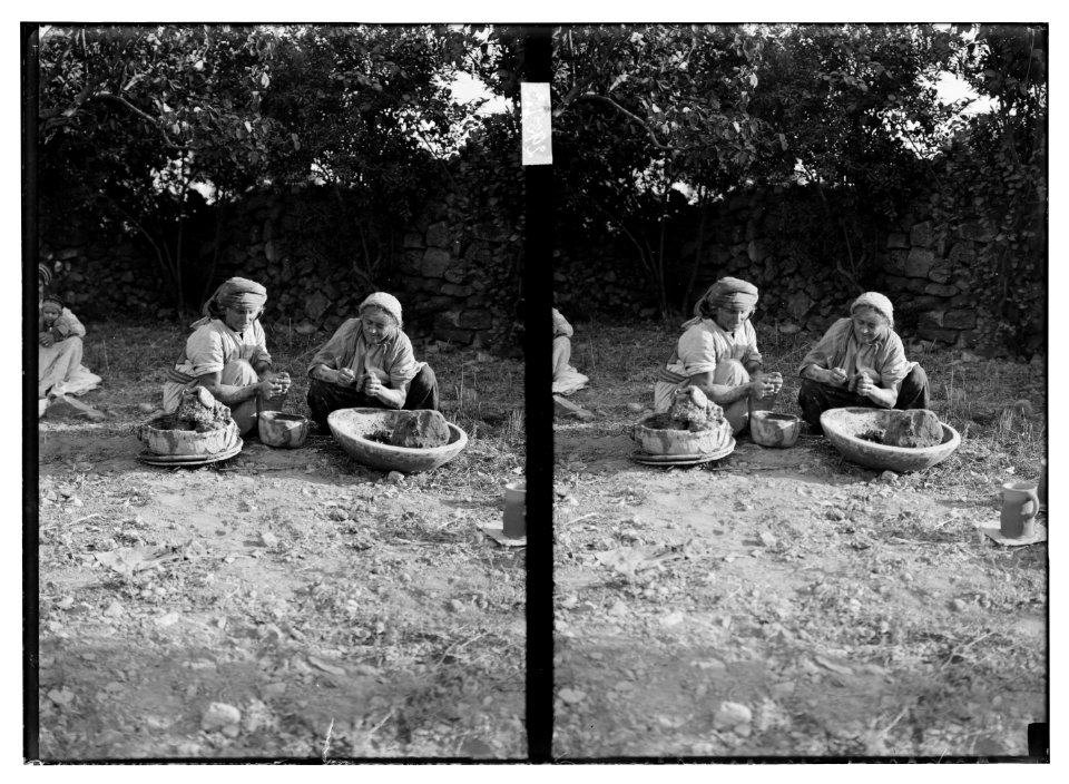 Two older village women create hand-thrown pottery. LOC matpc.04649