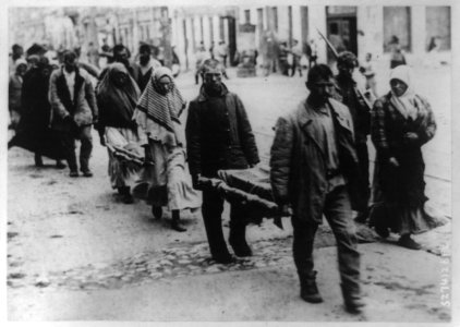 Two small coffins being carried on stretchers to cemetery in the Volga famine district of Bolshevist Russia LCCN92500054