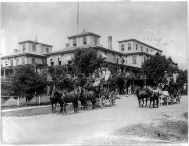 Two stage coaches loaded with people in front of hotels, Saratoga Springs, N.Y. LCCN2003688916