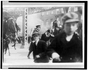 Two policemen arresting a striker in Express strike, New York City LCCN96514678