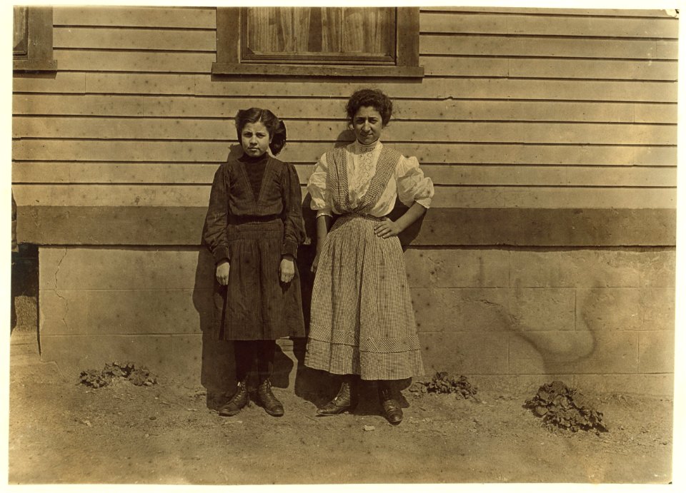 Two Portuguese girls working in Royal Mill, River Point, R.I. Younger girl, Mary Fartado 'Works on lace.' Been in mill 3 years. Other girl 3 years too. they do not speak English. LOC nclc.01679