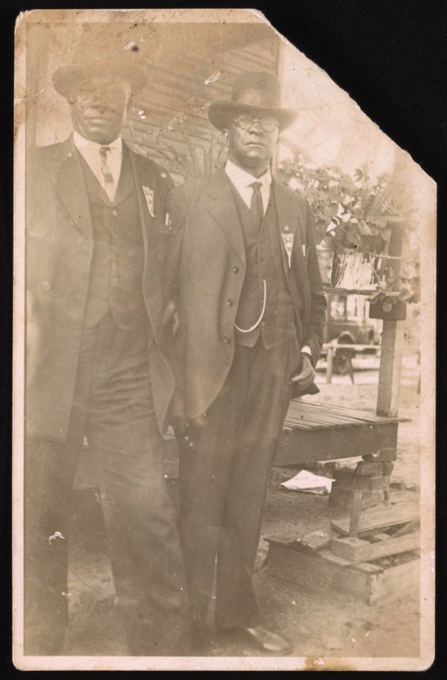 Two unidentified men standing outside, possibly in front of a home LCCN2015650003