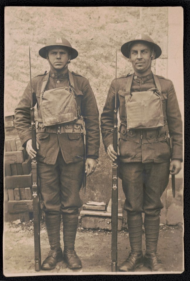 Two unidentified soldiers of the 77th Division in uniform with bayoneted rifles and gas mask bags LCCN2018645964