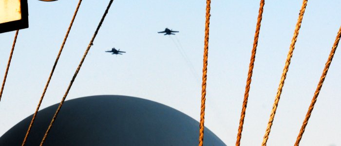 Two U.S. Navy F-A-18E Super Hornet aircraft assigned to Strike Fighter Squadron (VFA) 31 fly over the aircraft carrier USS George H.W. Bush (CVN 77) June 29, 2014, in the Persian Gulf 140629-N-CZ979-587
