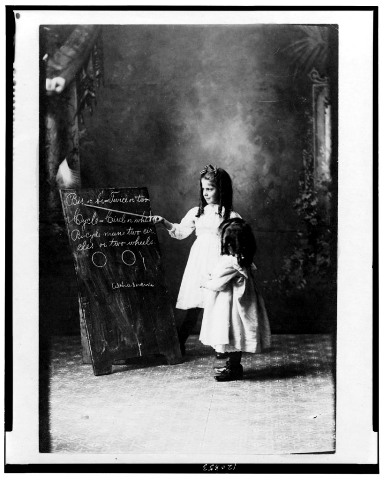 Two young girls at a blackboard LCCN98507574