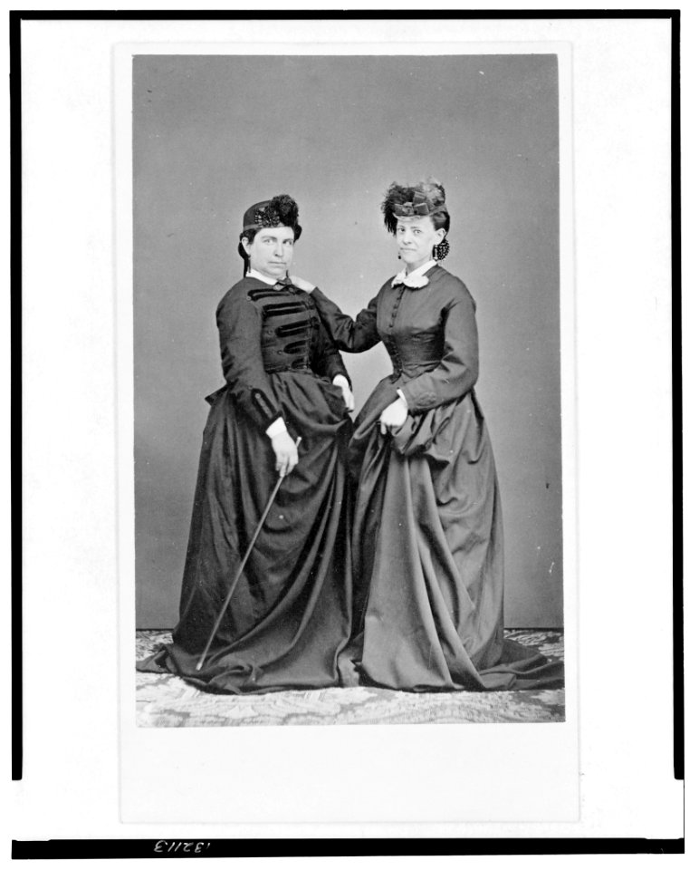 Two women, full-length portrait, standing, turned slightly toward each other, facing front LCCN2005692516