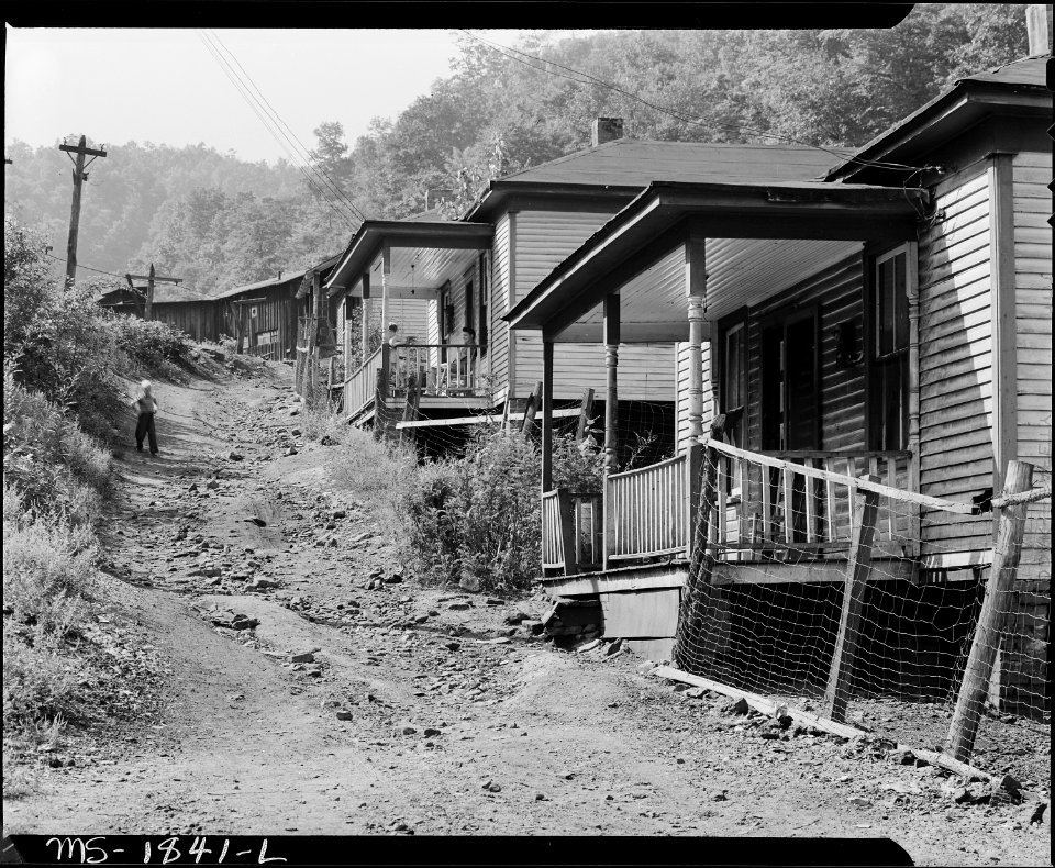 Typical houses and street. Comment of miner, The mine is about worked out and the houses are sure worked out.... - NARA - 540954