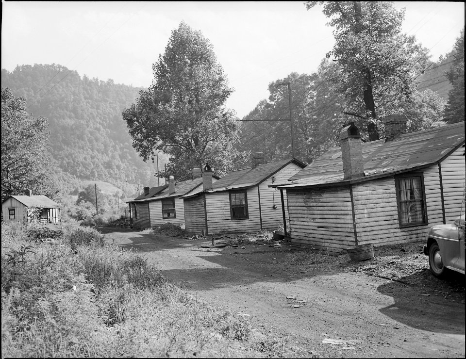 Typical three room houses at Big Sandy. Miners are charged $8 monthly for bus transportation to the mines at Exeter.... - NARA - 540715