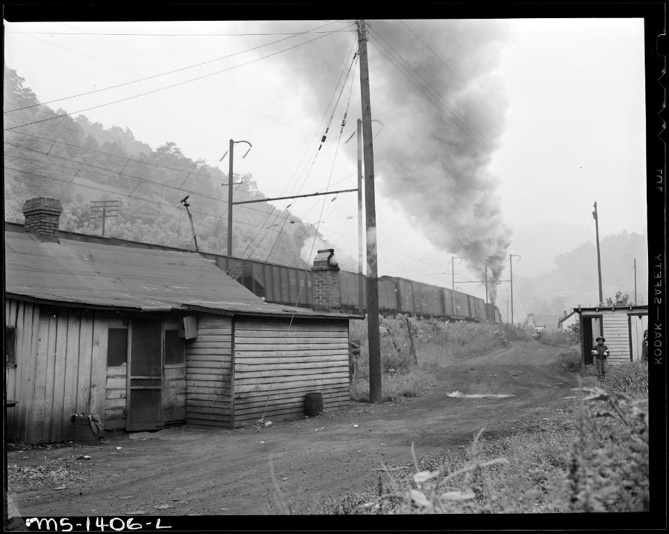 Typical house with coal cars in background. Kingston Pocahontas Coal Company, Exeter Mine, Welch, McDowell County... - NARA - 540784