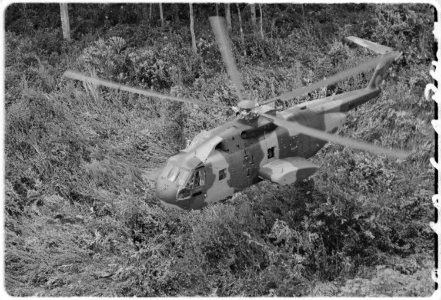 U.S. Air Force CH3E helicopter approaching landing zone in Southeast Asian jungle during operation Pony Express. - NARA - 542306