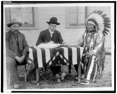 U.S. allotting surveyor and his interpreter making an American citizen of Chief American Horse, Oglala Sioux LCCN96500768