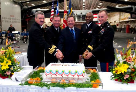 U.S. Ambassador to Chile Michael Hammer, center, and U.S. military officers cut a ceremonial cake during a reception aboard the amphibious assault ship USS America (LHA 6) Aug. 25, 2014, in Valparaiso, Chile 140825-N-LQ799-271