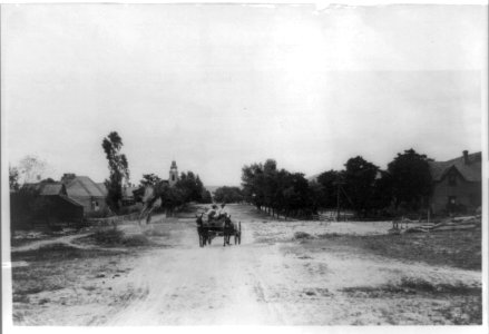 U.S. Army Punitive Expedition after Villa, 1916- Street scene in the Mormon town of Colonia Juarez, showing two men in wagon drawn by mules LCCN2002718578