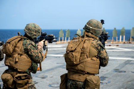 U.S. Marines assigned to Battalion Landing Team, 2nd Battalion, 5th Marine Regiment, 31st Marine Expeditionary Unit (MEU) participate in a live-fire exercise aboard the amphibious transport dock ship USS Denver 140319-N-ZU025-065