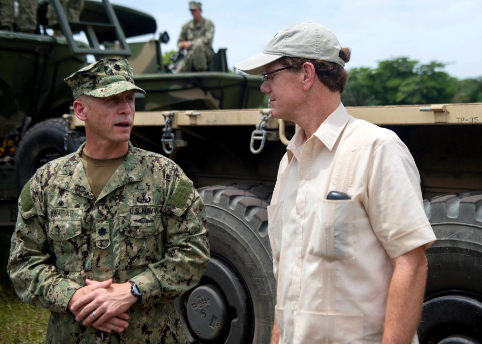 U.S. Ambassador to Honduras James D. Nealon, right, speaks with U.S. Navy Cmdr. Jeffrey V. Morganthaler, the commanding officer ashore of Southern Partnership Station (SPS) 2014, while touring a camp in Puerto 140901-N-QY430-476