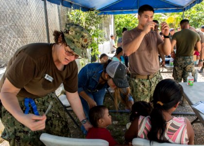 U.S. and Guatemalan service members, Ministry of Education teachers and Ministry of Health doctors and nurses tend to Guatemalan patients at a medical civic action project (MEDCAP) in Puerto Barrios, Guatemala 140823-N-QY430-081