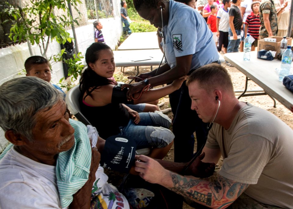U.S. and Guatemalan service members, Ministry of Education teachers and Ministry of Health doctors and nurses tend to Guatemalan patients at a medical civic action project (MEDCAP) in Puerto Barrios, Guatemala 140823-N-QY430-414