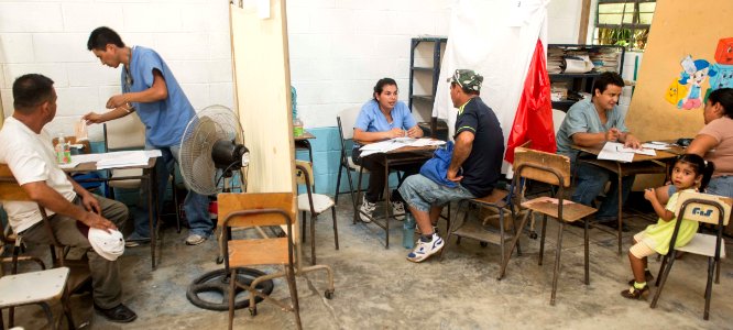 U.S. and Guatemalan service members, Ministry of Education teachers and Ministry of Health doctors and nurses tend to Guatemalan patients at a medical civic action project (MEDCAP) in Puerto Barrios, Guatemala 140823-N-QY430-543