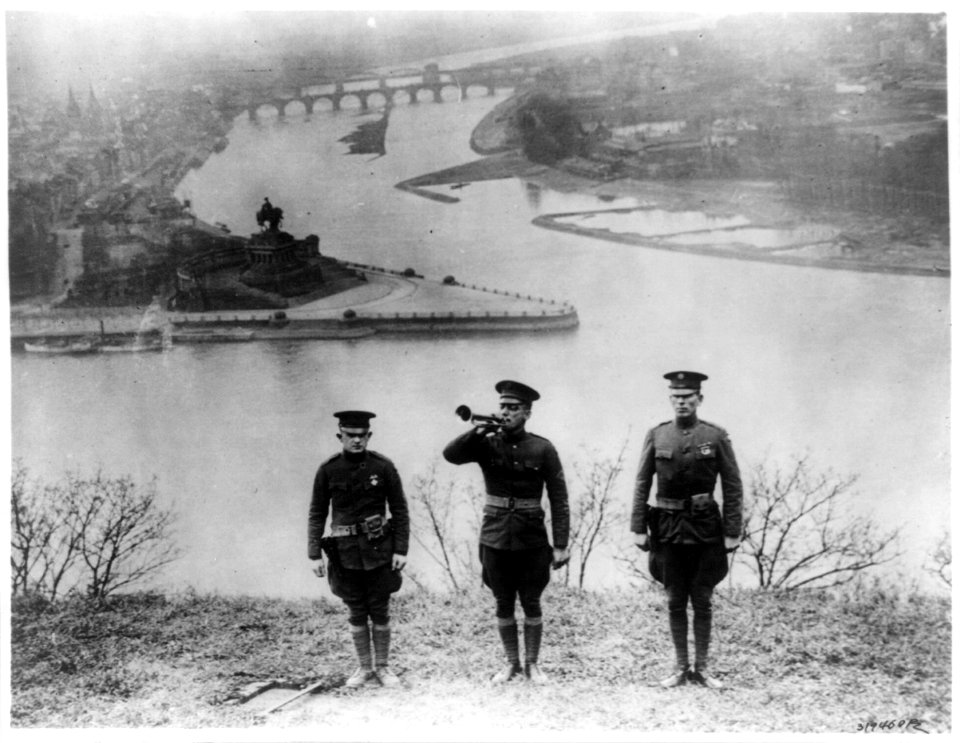 U.S. Army bugler with escorts sounding the Last Post at Fort Ehrenbreitstein signalling the departure of the last of the Army of Occupation from the Rhineland; Coblenz, Geramny LCCN2017657352