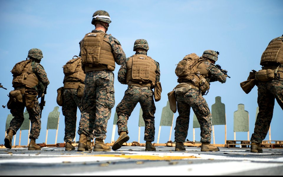 U.S. Marines assigned to Battalion Landing Team, 2nd Battalion, 5th Marine Regiment, 31st Marine Expeditionary Unit (MEU) participate in a live-fire exercise aboard the amphibious transport dock ship USS Denver 140319-N-ZU025-153