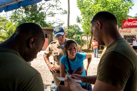U.S. and Guatemalan service members, Ministry of Education teachers and Ministry of Health doctors and nurses tend to Guatemalan patients at a medical civic action project (MEDCAP) in Puerto Barrios, Guatemala 140823-N-QY430-310
