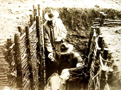 U.S. Army Hospital Corps soldiers in the first line trenches rendering aid, AEF, WWI (32832945521) photo
