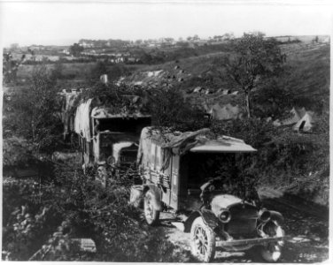 U.S. Army in France- Camouflaged trucks in foregrd. LCCN2003690389