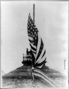 U.S. Army lowering the Stars & Stripes from Fort Ehrenbreitstein to mark the departure of the last of the Army of Occupation from the Rhineland; Coblenz, Geramny LCCN2017657353