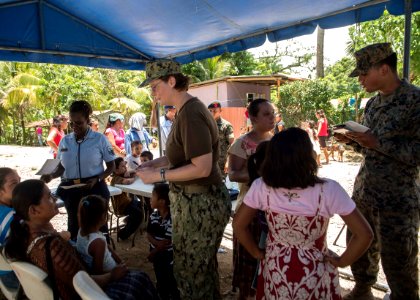 U.S. and Guatemalan service members, Ministry of Education teachers and Ministry of Health doctors and nurses tend to Guatemalan patients at a medical civic action project (MEDCAP) in Puerto Barrios, Guatemala 140823-N-QY430-680