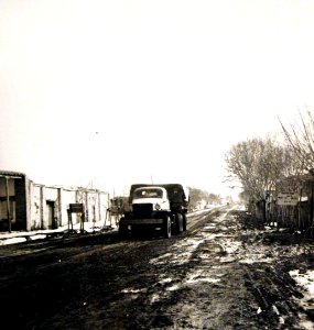 U.S. Army truck carrying supplies for the aid of Russia, passing through a village, Persian Corridor. (25133753295)
