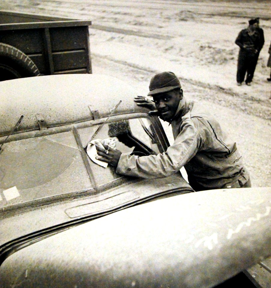 U.S. Army soldier cleaning windshield of truck during convoy operations to Russia (24506913803)