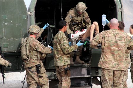 U.S. coalition forces treat Afghan National policeman at FOB Farah 121120-N-IE116-336