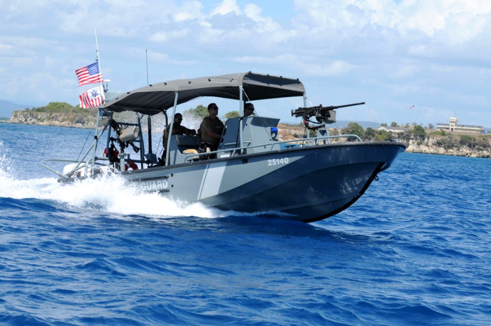 U.S. Coast Guard Maritime Safety and Security Team (MSST) 91114 patrols the Guantanamo Bay coastline 110310-N-PB660-205