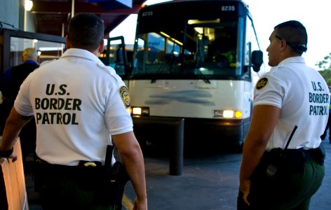 U.S. Customs and Border Protection Agents Check Bus photo