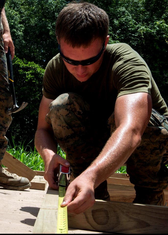 U.S. Marine Corps Cpl. Ben Stogner, with the 8th Engineer Support Battalion, 2nd Marine Logistics Group, helps build a sea hut during Southern Partnership Station (SPS) 2014 in Puerto Barrios, Guatemala 140813-N-QY430-021