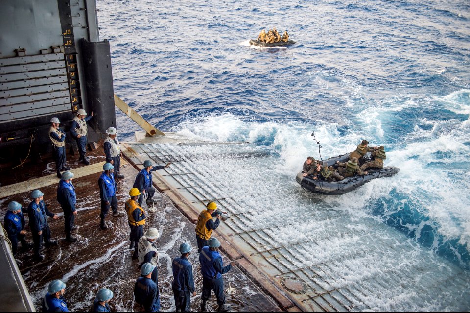 U.S. Marines assigned to Foxtrot Company, Battalion Landing Team, 2nd Battalion, 5th Marine Regiment, 31st Marine Expeditionary Unit conduct launch and recovery operations with combat rubber raiding craft from 140301-N-ZU025-322