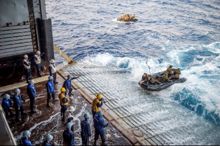 U.S. Marines assigned to Foxtrot Company, Battalion Landing Team, 2nd Battalion, 5th Marine Regiment, 31st Marine Expeditionary Unit conduct launch and recovery operations with combat rubber raiding craft from 140301-N-ZU025-322
