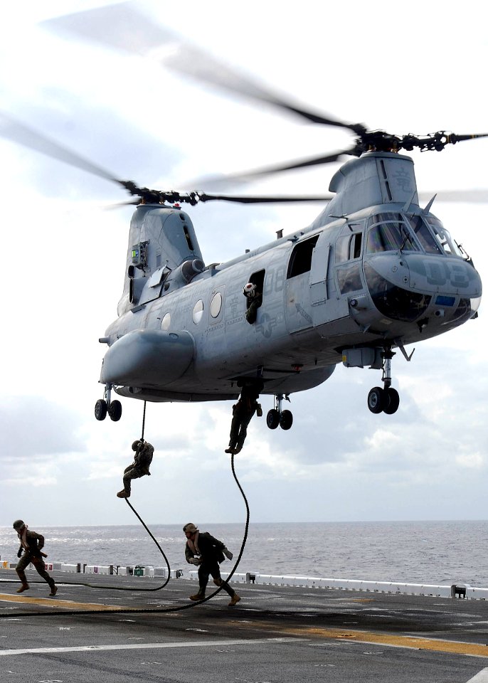 U.S. Marines assigned to the 31st Marine Expedition Unit fast-rope from a CH-46E Sea Knight helicopter