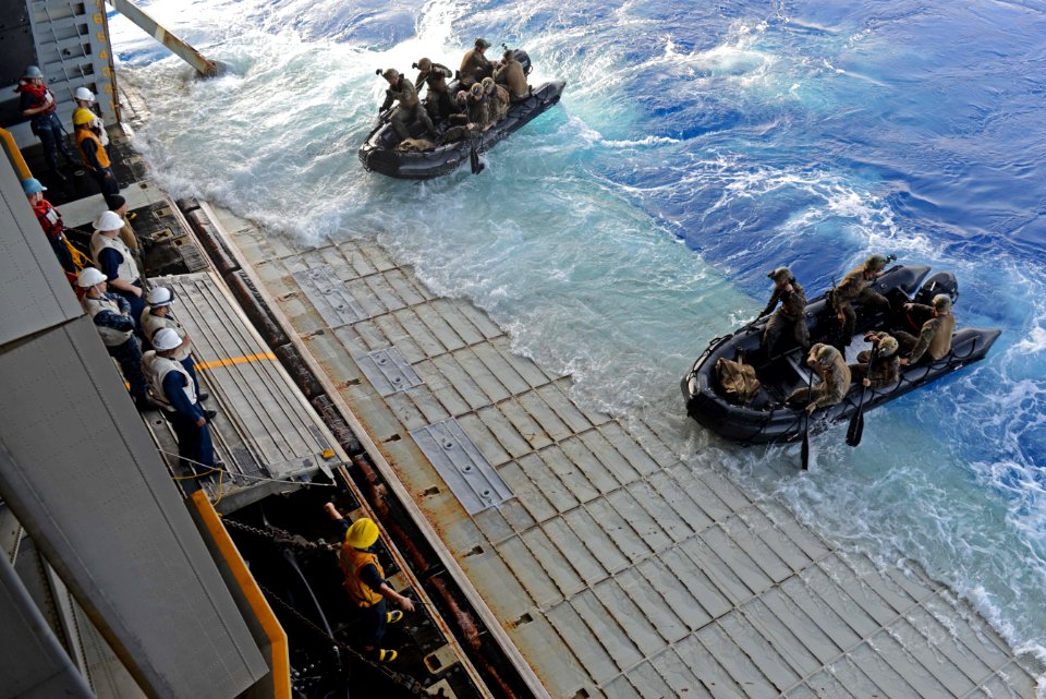 U.S. Marines assigned to the 31st Marine Expeditionary Unit cast off in combat raiding rubber crafts from the amphibious assault ship USS Bonhomme Richard (LHD 6) in the East China Sea March 1, 2014 140301-N-BJ178-188