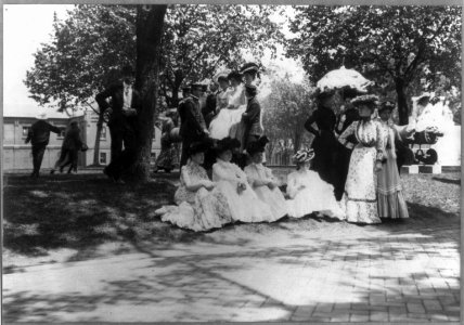 U.S. Naval Academy, Annapolis- cadets and women on lawn LCCN2005680861