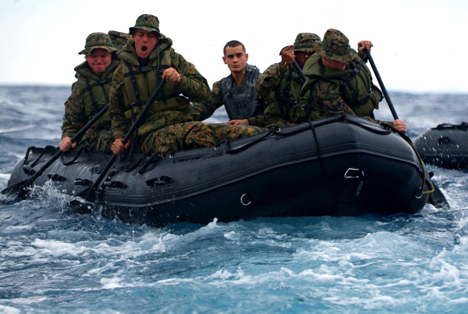 U.S. Marines aboard a combat rubber raiding craft