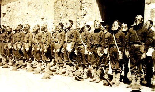 U.S. Marines in their gas masks during a gas mask drill, France, WWI (32916863386)