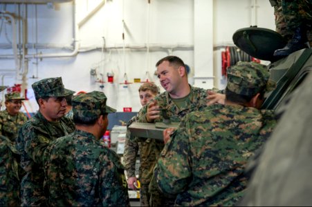U.S. Marine Corps Staff Sgt. Christopher Chambers, second from right, assigned to Special Purpose Marine Air-Ground Task Force South, speaks with Peruvian sailors about U.S. Marine Corps vehicle capabilities 140902-N-MZ309-064