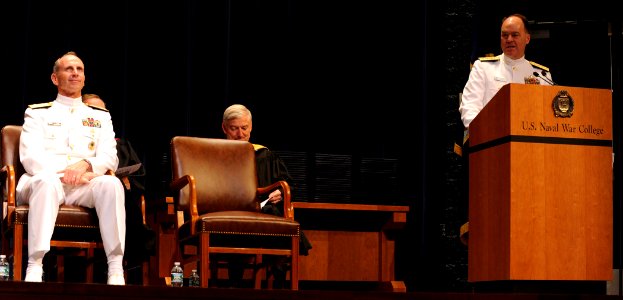 U.S. Navy Adm. Jonathan W. Greenert, foreground left, the Chief of Naval Operations, looks on as Rear Adm. John N. Christenson, at lectern right, the president of the U.S. Naval War College, gives the welcoming 130621-N-PX557-138