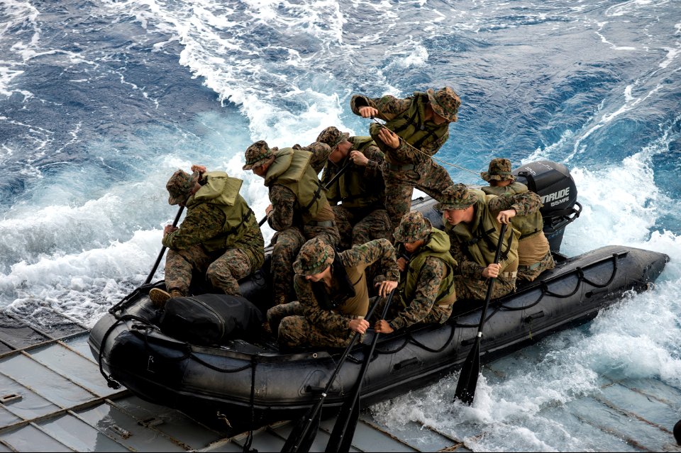 U.S. Marines assigned to Foxtrot Company, Battalion Landing Team, 2nd Battalion, 5th Marine Regiment, 31st Marine Expeditionary Unit conduct launch and recovery operations with a combat rubber raiding craft from 140301-N-ZU025-136