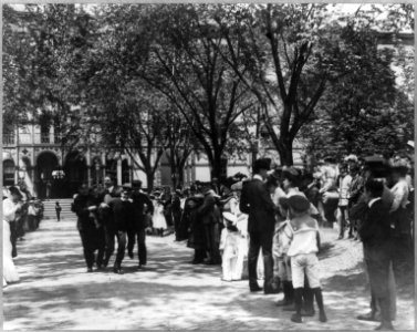 U.S. Naval Academy, Annapolis- 4 midshipmen carrying a man; crowd of guests along sidewalk LCCN2005680866