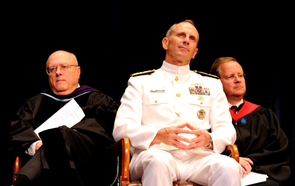 U.S. Navy Adm. Jonathan W. Greenert, center, the Chief of Naval Operations, listens to the opening remarks during a graduation ceremony at the U.S. Naval War College in Newport, R.I., June 21, 2013 130621-N-PX557-155