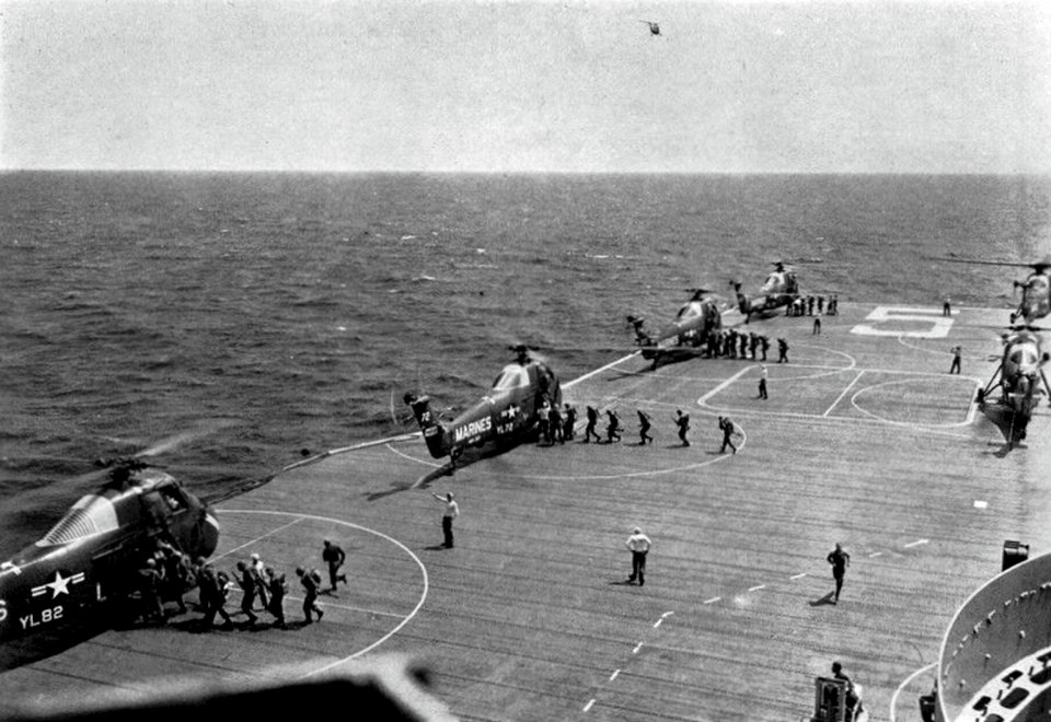 U.S. Marines board Sikorsky HUS-1 of HMR-362 aboard USS Princeton (LPH-5), in 1960