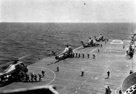 U.S. Marines board Sikorsky HUS-1 of HMR-362 aboard USS Princeton (LPH-5), in 1960